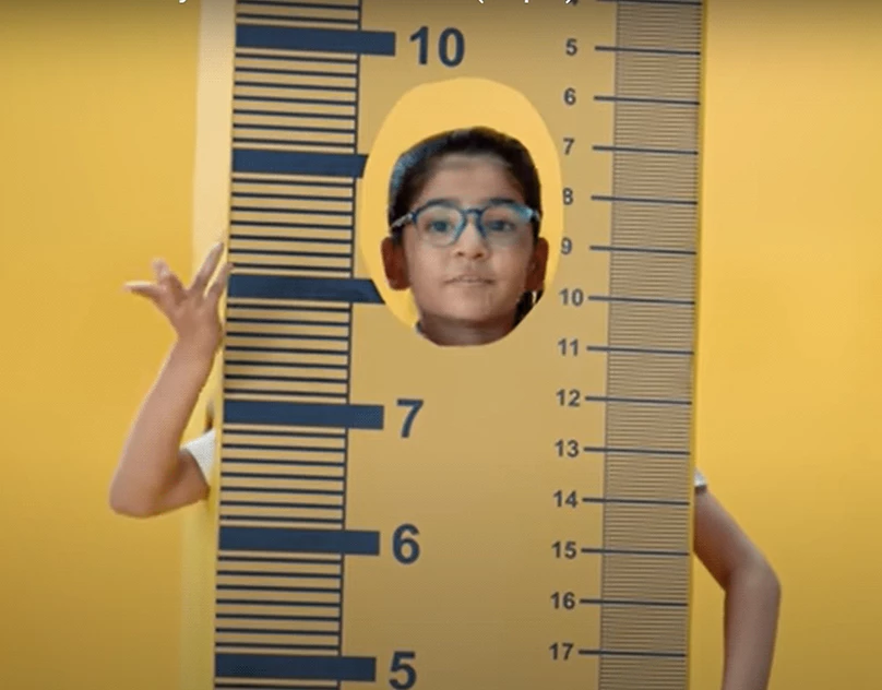 Child against a measuring ruler